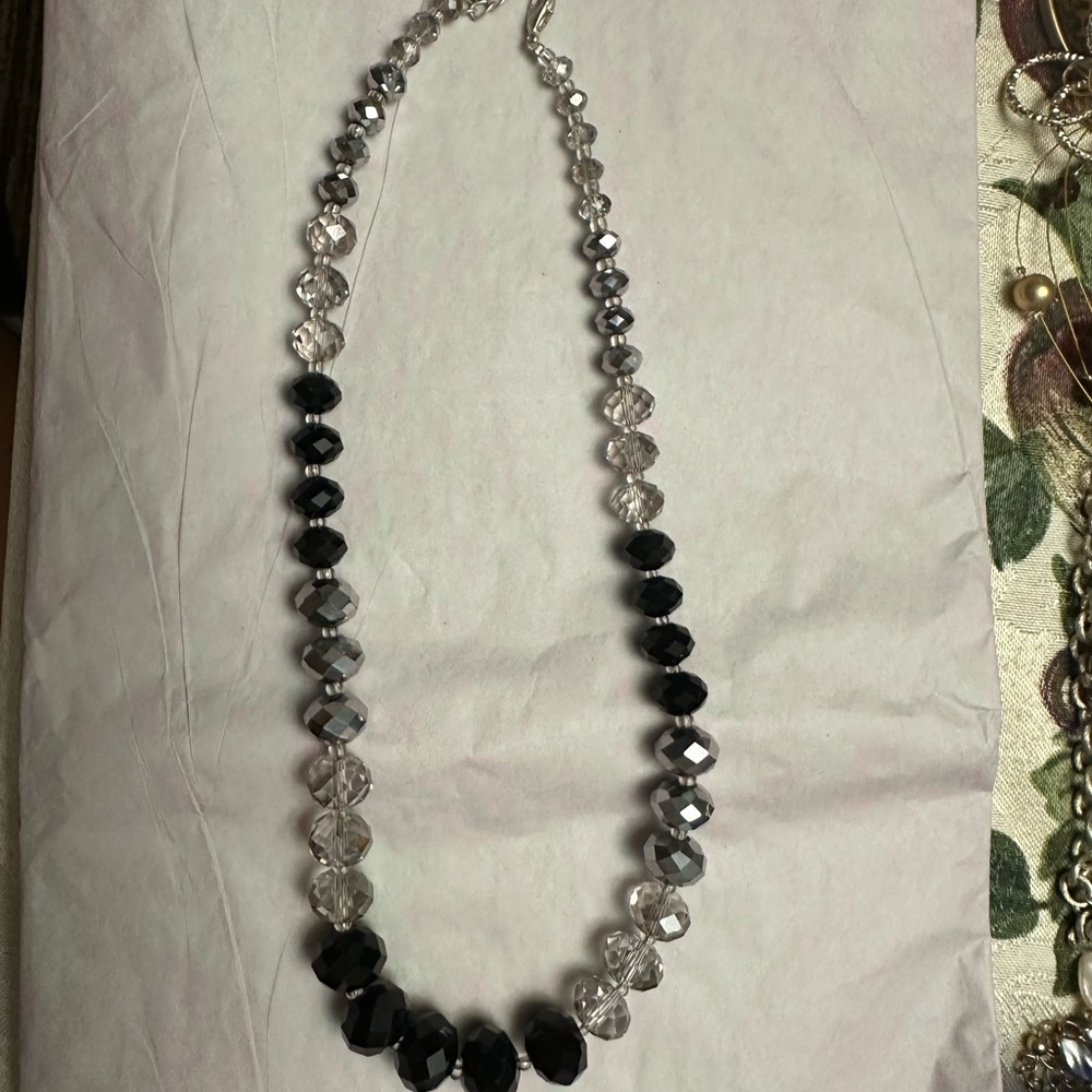 Black, silver and clear beaded necklace. Costume jewelry. 18 inches w/ extender